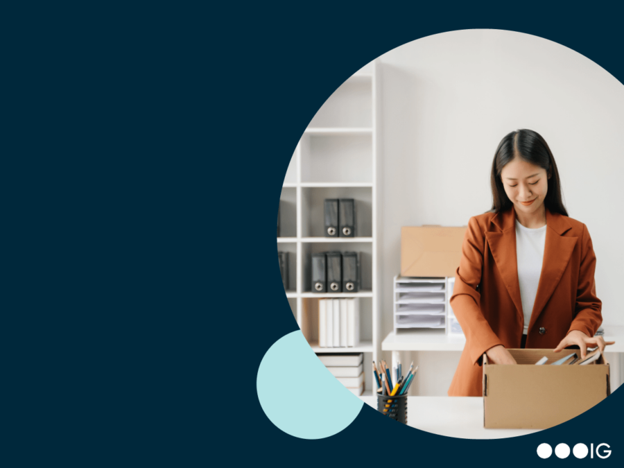 Navy background. Light blue accent circle. Insight Global logo. Circle crop of a businesswoman packing up her desk, as she transitions from one role to another.